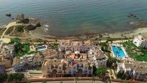 Apartment, with private terrace and in beachfront urbanization with heated pool, in Casares Costa