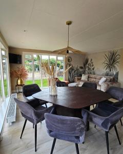 Holiday house with private SAUNA and HOTTUB on park de Ijsvogel with swimming pools and children entertaiment AIRCO