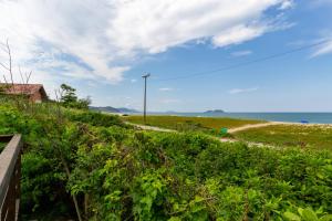Sobrado Pé na Areia na Praia da Armação P143