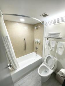 Interior Entrance Queen Room with Two Queen Beds - Non-Smoking room in Ramada by Wyndham Tuscaloosa