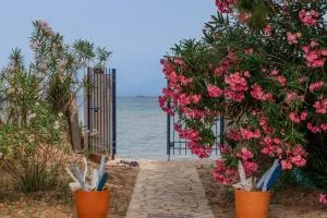 SUNRISE BEACH VILLA, - garden gate opens onto the beach - 莱夫基米