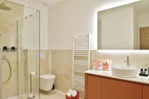 Villas Residence Les volets rouges - Duplex de standing avec piscine : photos des chambres