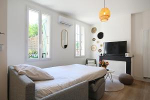 Appartements L'Ethnique 7p - Climatisation - Jardin - Parking - Salle de Sport : photos des chambres