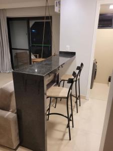 Flat com piscina, academia e vista para o mar