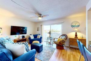 Just Cocoa Beachy - Cozy beachside condo with pool and beach access