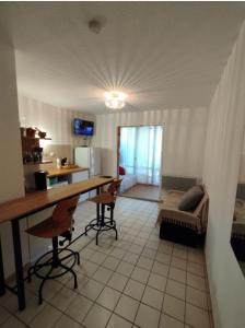 Appartements Rez-de-jardin climatise : photos des chambres