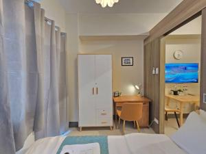 1BR Condotel with Balcony at FAME Residences #FM48