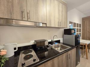 1BR Condotel with Balcony at FAME Residences #FM49