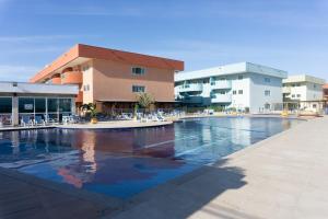 Apê aconchegante condomínio beira lagoa cpiscina