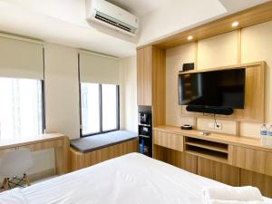 Cozy and Homey Studio Room Pollux Chadstone Apartment By Travelio