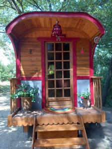 Tentes de luxe La roulotte du petit paradis : photos des chambres
