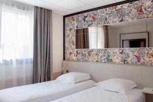 Hotels Brit Hotel Nantes La Beaujoire Parc Expo : photos des chambres