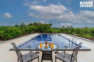 StayVista at Terracotta Skies with Courtyard & Pool