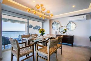 Upscale Corner Unit with Large Wrap Around Balcony and Pools