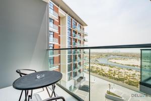 Cosmopolitan 1BR Apartment in Celestia B, Dubai South by Deluxe Holiday Homes