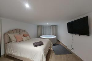 Appartements L08 Jacuzzi 5 Etoile par Villa Dengous : photos des chambres