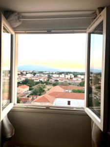 Appartements Appartement a mi chemin entre aeroport et centre ville - Vue sur les montagnes - Echappee Belle : photos des chambres