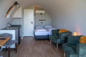 Tiny Natuurlodge Graspieper met vrij uitzicht over landerijen