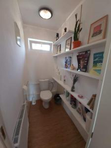 Cozy farmhouse next to a pond for a peaceful retreat