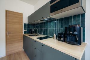 Appartements Le clocher du chateau : photos des chambres