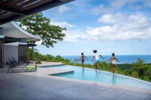 Luxurious Ultramodern Property with Private Suites, Infinity Pool, and Sweeping Ocean and Mountain Views