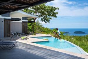 Luxurious Ultramodern Property with Private Suites, Infinity Pool, and Sweeping Ocean and Mountain Views