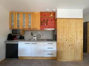 Appartements Appartement coeur de village tous services : photos des chambres
