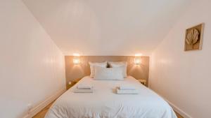 Appartements Charmante Maisonnette : photos des chambres