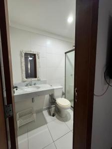 Casa com 4 suítes perto da praia