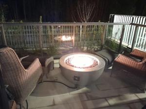 Nature trail view with cozy patio and firetable