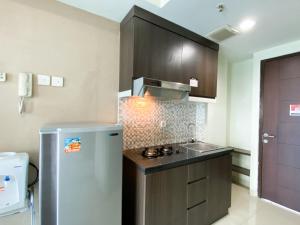 Cozy Studio at 20th Floor Grand Dhika City Apartment By Travelio