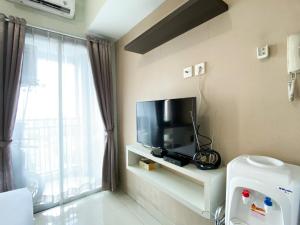 Cozy Studio at 20th Floor Grand Dhika City Apartment By Travelio