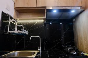 Best Location Studio Apartment at Grand Asia Afrika By Travelio