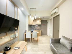 Simply Look and Comfort 1BR Vasanta Innopark Apartment By Travelio