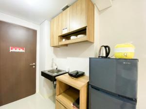 Chic and Cozy Studio Apartment at Transpark Juanda Bekasi By Travelio