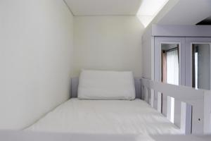 Comfort 2BR Apartment at 30th Floor Transpark Cibubur By Travelio