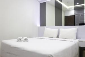 Comfort 2BR Apartment at 30th Floor Transpark Cibubur By Travelio
