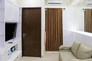 Comfort 2BR Apartment at 30th Floor Transpark Cibubur By Travelio