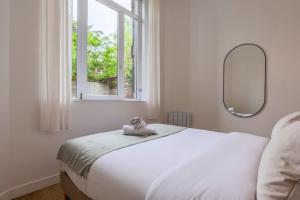 Appartements Appartement une chambre avec jardin, proche tram : photos des chambres