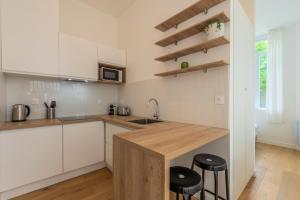 Appartement une chambre avec jardin, proche tram