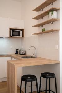 Appartements Appartement une chambre avec jardin, proche tram : photos des chambres