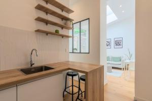 Appartements Appartement une chambre avec jardin, proche tram : photos des chambres