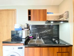 Comfort 1BR at Gateway Park LRT City Bekasi Apartment By Travelio