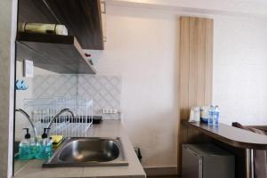 Homey and Cozy 2BR at Mekarwangi Square Cibaduyut Apartment By Travelio