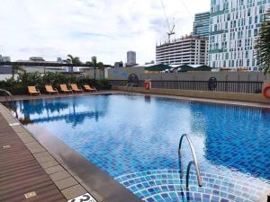 Cubao Manhattan Plaza Residential Condo T139G - HUGE Studio with Pool, Kitchen & Balcony, Walk Distance to Araneta Coliseum LRT MRT Malls in Cubao Quezon City - Staycations by SMS