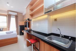 Nice and Fancy Studio at Transpark Cibubur Apartment By Travelio