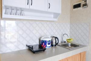 Spacious Designed 2BR Apartment at Mekarwangi Square Cibaduyut By Travelio