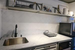 Studio with Private Living Room at Jarrdin Cihampelas Apartment By Travelio