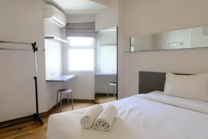 Homey 1BR at Apartment Parahyangan Residence By Travelio
