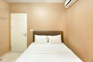 Comfort and Elegant 4BR Combined at Springlake Summarecon Bekasi Apartment By Travelio